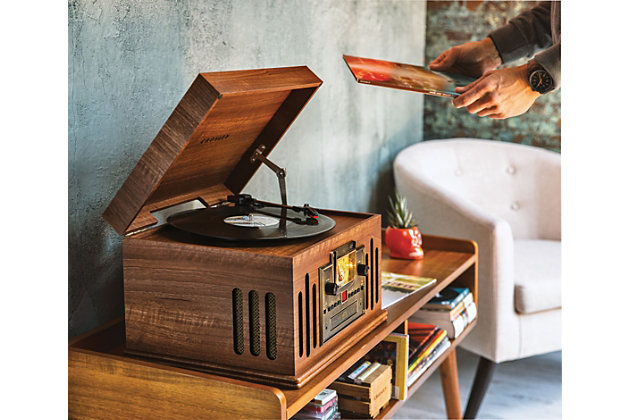 Give analog music the encore it deserves with the musician's three-speed turntable housed in a beautiful hardwood cabinet finished with rich veneers. The vintage-inspired style sports modern technology, with a cd player, cassette deck, am/fm radio and even a built-in bluetooth receiver so you can jam your digital tracks wirelessly.  the musician is the master of entertainment.3–speed turntable (33 1/3, 45 & 78 rpm) | Built-in bluetooth receiver | Cd player | Cassette player | Am/fm radio | Cueing lever | Aux input