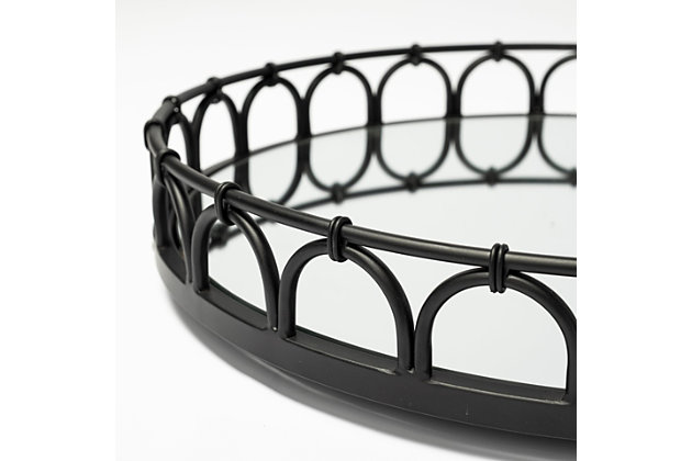 Crafted from metal and finished in a matte black tone, this stunning round tray  flaunts a mirrored glass bottom and intricately styled railings. With an elegant design that is complemented by the uni-tone finish, it fits perfectly in spaces based on the Mercana Modern design style.Made with metal | Mirror inlay | Finished in matte black | Curved semi-circle design on frame | No assembly required