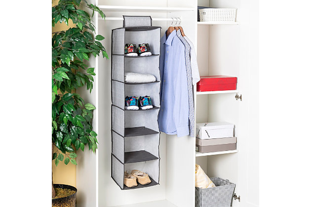 Bring an end to clutter floors and make use of vertical space in the closet with this hanging closet organizer. Open style compartments allow you to easily see items at a quick glance. The sturdy metal hooks can be used on closet rods or a rack. Spot clean.Open cubby style shelves for easy access to items | Velcro strap with thick metal hooks to secures to the closet rod | Folds flat for space-saving storage | Made of breathable non-woven material with decorative herringbone pattern