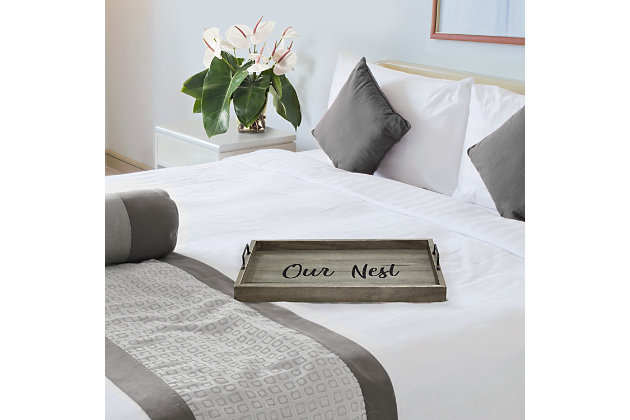 Freshen up your home with this rustic gray wooden tray!  Accented with black metal handles and black text this tray is on trend to give your home that cozy farmhouse feel.  Use to serve breakfast in bed, food and drinks at a party or makes for an excellant centerpiece for your dining table, kitchen counter, coffee table or ottoman.Rustic gray finish on wood | Black "home" text | Black metal handles | On-trend farmhouse design | Tray measures l: 15.50" x w: 12" x h:2.25"