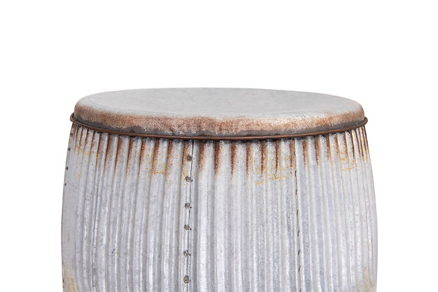 Our round metal stool is highly detailed and pleasantly chic. It can also be used as a side table or alternate between the two depending on which is most needed. The rust detail around the edges adds a country, rustic feel.Metal construction | Heavily distressed finish | Can alternate between a stool or a side table | 16.5l x 16.5w x 17.5h in.