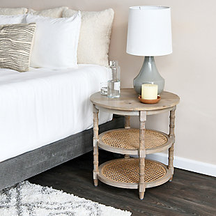 There is no end to the places that need this grey three tier table. Use it as an end table, night stand or put it in a random corner full of knick knacks. It is practical as well as a beautiful piece of furniture with an abundance of space for organizing or displaying items.Features three full levels for displaying items or organizing the home | Place a decorative plant on top and fill the bottom shelves with decorative figurines | Use next to the bed and keep kleenex, books, computer and miscellaneous items within reach | 23.5"l x 23.5"w x 24"h | Shelves have a decorative cane center | Perfect for the home or office