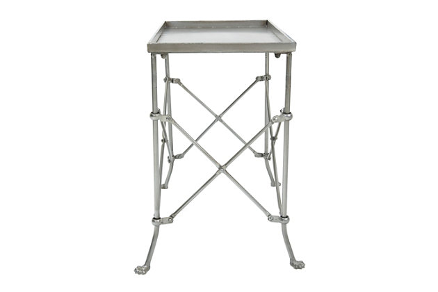 This handsome rustic bronze-finished metal table is just the perfect size to accent a chair or sofa. With it's architectural structure and whimsical yet classical feet, it is sure to be a welcome addition to any home.  The table is slim, sturdy and stylish. Its fashionable design makes it a classy addition to a traditional living room, dining room or office.Use this lovely piece as a side or accent table | Can also be used as a tray table when having guests | Easily move from room to room wherever it is needed | 20"l x 12"w x 20"h