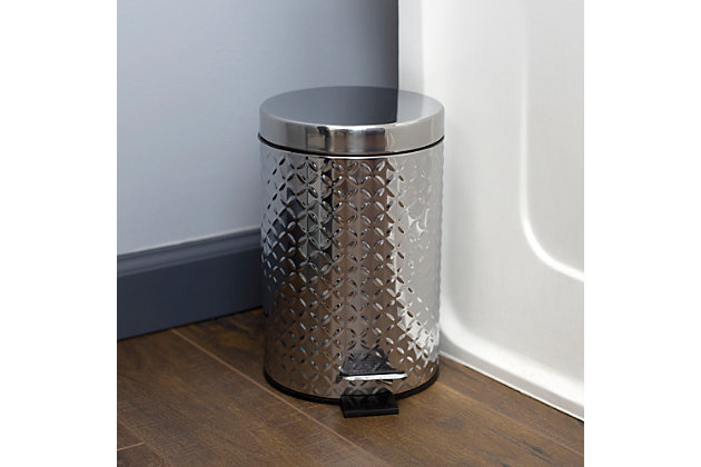 Bring a touch of bold, modern appeal with this eye-catching stainless steel  waste bin. The bin is crafted from thick and resilient stainless steel with a diagonal embossing detailing that makes a stylish statement, while also great for minimizing the appearance of surface scratches. It features a sturdy step activated top that keeps your hands free while disposing trash, along with a plastic interior bucket that can be easily be removed to clean.  The metal handle lets you transport it from one destination to the next in a breeze.3 lt step-on operated lid to provide a sanitary way to discard garbage | Removable plastic interior bucket lifts out to be clean or used separately from the waste bin | Built-in metal handle for easy transport | Made of high strength stainless steel for ultra durability with  emboss design for a stylish flair