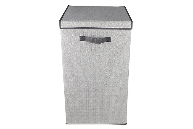 Keep your laundry load off the floor and neatly stored in this enclosed non-woven laundry hamper.   With a premium quality stitched nylon handle you can bring the hamper to and from the wash as needed.  The interior accommodates a large single load and the exterior features an elegant herringbone pattern.  Spot clean.Enclosed hamper keeps laundry off the floor and out of sight | Secure velcro closure to prevents odors from circulating the air | Premium quality stitched handles for easy transport | Made of breathable non-woven material with decorative herringbone pattern
