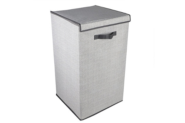 Keep your laundry load off the floor and neatly stored in this enclosed non-woven laundry hamper.   With a premium quality stitched nylon handle you can bring the hamper to and from the wash as needed.  The interior accommodates a large single load and the exterior features an elegant herringbone pattern.  Spot clean.Enclosed hamper keeps laundry off the floor and out of sight | Secure velcro closure to prevents odors from circulating the air | Premium quality stitched handles for easy transport | Made of breathable non-woven material with decorative herringbone pattern