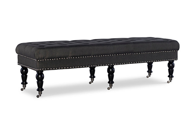 Given its scale, the richly styled Isabelle bedroom bench looks perfectly placed at the foot of the bed. Of course, it’s just as welcome and practical in an entryway or under a window. Deep tufting enhances the bench’s charcoal linen fabric, while classically turned legs in a black finish are a striking complement. Casters make it easy to enjoy.Made with solid wood, birch | Polyester linen upholstery | Ca fire foam cushion | Tufted seat | Silvertone nailhead trim | Casters for easy mobility | Exposed legs with black finish | Assembly required
