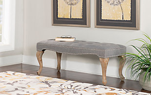 Striking a pose with curvaceous cabriole legs and a deeply tufted padded seat, the Loire bench brings a très chic twist to the scene. Washed linen fabric is complemented with a washed gray wood finish for a mood of easy elegance and French country flair.Made with solid wood, birch | Washed linen upholstery | CA fire foam cushion | Tufted seat | Brush silvertone nailhead trim | Exposed legs with gray wash finish | Assembly required