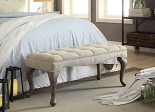 Striking a pose with curvaceous cabriole legs and a deeply tufted padded seat, the Loire bench brings a très chic twist to the scene. Washed linen fabric is complemented with a washed gray wood finish for a mood of easy elegance and French country flair.Made with solid wood, birch | Washed linen upholstery | CA fire foam cushion | Tufted seat | Brush silvertone nailhead trim | Exposed legs with gray wash finish | Assembly required