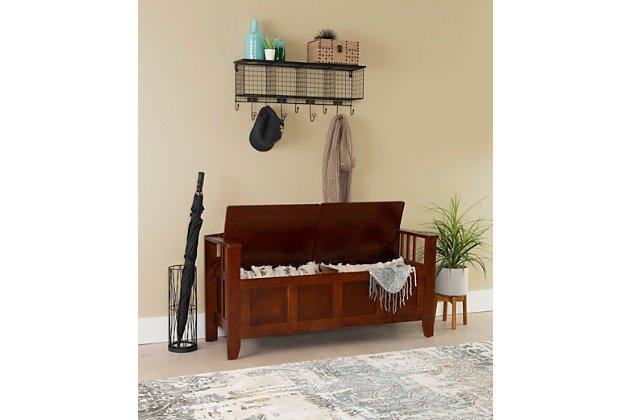 If you’re split between needing seating or storage space, get the best of both with this split seat storage bench. What a welcome addition to an entryway or mudroom. This storage bench offers a distinctive split seat design with low-back slat styling. Ample storage compartment handily houses everything from backpacks and umbrellas, to shoes and sports gear.Made of poplar wood and veneers | Walnut finish | Split-seat design | Flip top with hinges opens to storage compartment | Assembly required