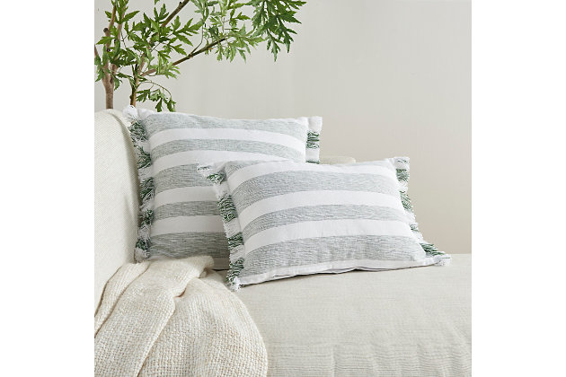 Refresh your room with the handcrafted, rustic appeal of this mina victory lumbar pillow in a nicely sized rectangle. Its bold stripes are chambray-woven for a casual effect that works beautifully in so many settings, from modern farmhouse to eclectic urban loft. This reversible pillow is striped front and back in garden green on white, with a zipper closure and a soft polyester insert. The removable cover is washable to keep that clean, fresh, country look.Handcrafted | Made of 100% cotton | Soft polyfill | Brush fringe border | Zipper closure | Imported | Machine wash