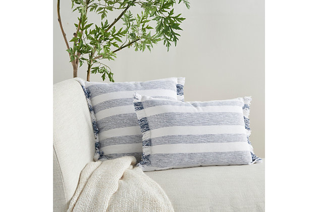 Refresh your room with the handcrafted, rustic appeal of this mina victory lumbar pillow in a nicely sized rectangle. Its bold stripes are chambray-woven for a casual effect that works beautifully in so many settings, from modern farmhouse to eclectic urban loft. This reversible pillow is striped front and back in navy blue on white, with a zipper closure and a soft polyester insert. The removable cover is washable to keep that clean, fresh, country look.Handcrafted | Made of 100% cotton | Soft polyfill | Brush fringe border | Zipper closure | Imported | Machine wash