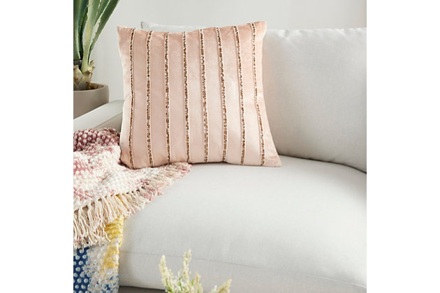 Lounge in luxury with this enchanting throw pillow by mina victory. Its lush and velvety blush pink cover is accented by rows of beaded stripes for an ultra-glam effect on your sofa, bed or chair. Handcrafted of velvet, this accent pillow has a zipper closure and a cozy polyester fill for added comfort.Handcrafted | Made of 100% velvet | Soft polyfill | Zipper closure | Beaded stripes | Imported | Spot clean
