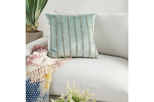 Lounge in luxury with this enchanting throw pillow by mina victory. Its lush and velvety cover in celadon green is accented by rows of beaded stripes for an ultra-glam effect on your sofa, bed or chair. Handcrafted of velvet, this accent pillow has a zipper closure and a cozy polyester fill for added comfort.Handcrafted | Made of 100% velvet | Soft polyfill | Zipper closure | Beaded stripes | Imported | Spot clean