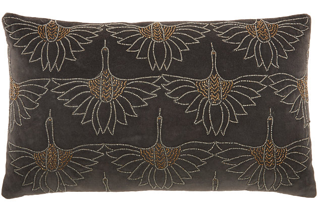 Art deco meets modern glam in this plush handmade mina victory lumbar pillow. Across its dark gray cotton cover, beaded floral motifs create a glamorous effect on your sofa, bed or chair. This lumbar pillow includes a springy polyester insert to help retain its rectangular shape, and a zipper closure for easy spot cleaning.Handcrafted | Made of 100% cotton | Soft polyfill | Zipper closure | Beaded floral motifs | Imported | Spot clean