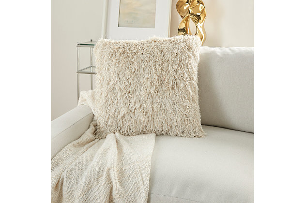 This funky shag pillow is the easiest way to add texture and a fresh style to any room. With its classic ivory hue and ultra-plush texture, this modern mina victory throw pillow offers premier comfort and style. Elegant in its simplicity, its solid-toned face is handcrafted of soft, ribbon-style polyester shag with a velvety-soft polyester back. Includes a removable polyester insert.Handcrafted | Made of 100% polyester | Removable soft polyfill insert | Zipper closure | Imported | Spot clean
