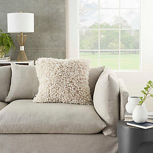 This funky shag pillow is the easiest way to add texture and a fresh style to any room. With its cream tone and ultra-plush texture, this modern Mina Victory throw pillow offers premier comfort and style. Elegant in its simplicity, its solid-toned face is handcrafted of soft, ribbon-style polyester shag with a velvety-soft polyester back. Includes a removable polyester insert.Handcrafted | Made of 100% polyester | Removable soft polyfill insert | Zipper closure | Imported | Spot clean