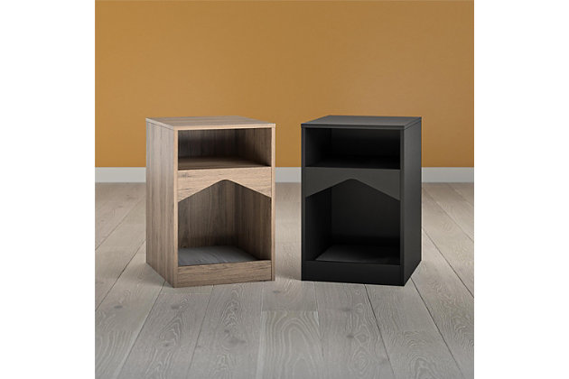 Your feline friend will have their own spot to lounge around all day with the Ollie & Hutch Roscoe Cat House End Table. Made of laminated particleboard, the sleek black finish will look great with any style and features a gray microfiber cushion so your cat can snooze away right by your side. The End Table offers an open cubby for you to organize electronics and reading material. The tabletop is perfect for a reading lamp and to hold snacks and electronics while watching your favorite shows and movies. The Cat House End Table ships flat to your door and requires assembly upon opening. Two adults are recommended to assemble. Once assembled, the End Table measures to be 24.06”H x 15.79”W x 20.04”D.Give your cat the perfect spot for a cat nap with the ollie & hutch roscoe cat house end table | Made of laminated particleboard with a classic black finish, the end table offers a gray microfiber cushion | The open cubby and tabletop can organize all of your electronics, reading material, and snacks | The cat house end table ships flat to your door and 2 adults are recommended to assemble. The tabletop and cat house can each hold 50 lbs. While the cubby can hold 20 lbs. Assembled dimensions: 24.06”h x 15.79”w x 20.04”d | 1 year limited warranty is included