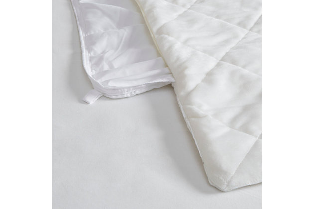 Sleep soundly with weighted comfort of the Beautyrest Duke Faux Fur Weighted Blanket. Designed for adults or those with a minimum body weight of 120lbs, this 60”x70” weighted blanket provides all-over comforting pressure to make you feel secure and relaxed. The ivory faux fur cover comes with a weighted insert that has box quilting to prevent the polyester and glass bead filling from shifting. Ten inner ties and a zipper closure on the faux fur blanket cover keep the insert secure. The cover itself is machine washable for easy care, while the insert needs to be spot cleaned. Perfect for your bed or lounging on the couch, this weighted blanket helps promote a comfortable and anxiety free sleep throughout the night. Available in 12lb and 18lb weights.Imported | Provides all over body comforting pressure, making you feel secure and relaxed | Beautyrest faux fur weighted blanket 60"x70" inches designed for adults or minimum body weight of 120 lbs or more | Two polyester filling layers to prevent in-between beads from shifting | Promotes a deep and restful sleep throughout the night | Removable faux fur cover zipper closure is machine washable for easy care | Weighted insert is box quilted to secure filling from shifting | 10 inside ties efficiently stay put the weighted insert