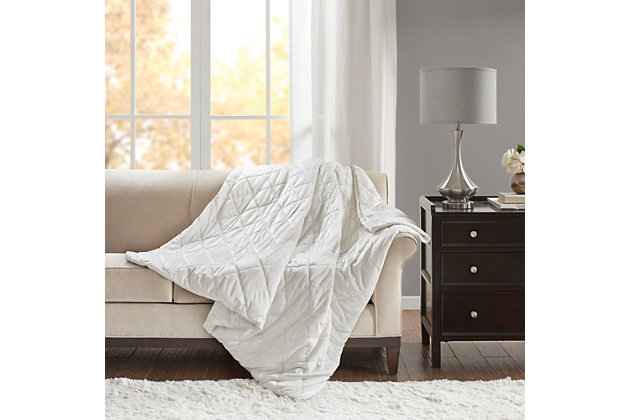 Stay relaxed and sleep soundly with the Beautyrest Luxury Quilted Mink Weighted Blanket. Designed for adults or those with a minimum body weight of 120lbs, this 60”x70” weighted blanket distributes pressure on your body, touching pressure points to make you feel secure and relaxed. The faux mink grey cover features diamond quilting and the weighted insert has box quilting to prevent the polyester and glass bead filling from shifting. Ten inner ties paired with a zipper closure on the cover keeps the insert secure.The cover itself is machine washable for easy care, while the insert needs to be spot cleaned. With its polyester and glass bead filling for weight, this heavy blanket creates a better quality rest. Available in 12lb and 18lb weights.Imported | Provides all over body comforting pressure for relaxation | 100% polyester faux mink fabric with diamond quilting | Poly fill and glass beads make up the filling weight for maximum comfort | Blanket size 60"x70" | Weighted insert is box sewn to keep fill in place | 10 inner ties keep insert from shifting | Removable blanket cover features a zipper closure | Cover is machine washable, insert is spot clean | Available in 12 lb and 18 lb weights | The weighted blanket is designed for adults or for a minimum body weight of 120 lbs or more