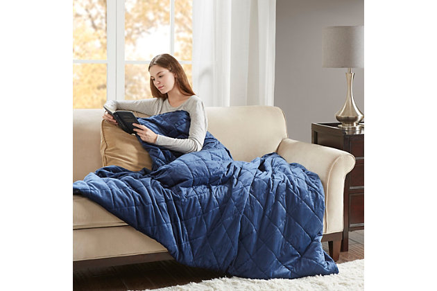 Stay relaxed and sleep soundly with the Beautyrest Luxury Quilted Mink Weighted Blanket. Designed for adults or those with a minimum body weight of 120lbs, this 60”x70” weighted blanket distributes pressure on your body, touching pressure points to make you feel secure and relaxed. The faux mink grey cover features diamond quilting and the weighted insert has box quilting to prevent the polyester and glass bead filling from shifting. Ten inner ties paired with a zipper closure on the cover keeps the insert secure.The cover itself is machine washable for easy care, while the insert needs to be spot cleaned. With its polyester and glass bead filling for weight, this heavy blanket creates a better quality rest. Available in 12lb and 18lb weights.Imported | Provides all over body comforting pressure for relaxation | 100% polyester faux mink fabric with diamond quilting | Poly fill and glass beads make up the filling weight for maximum comfort | Blanket size 60"x70" | Weighted insert is box sewn to keep fill in place | 10 inner ties keep insert from shifting | Removable blanket cover features a zipper closure | Cover is machine washable, insert is spot clean | Available in 12 lb and 18 lb weights | The weighted blanket is designed for adults or for a minimum body weight of 120 lbs or more