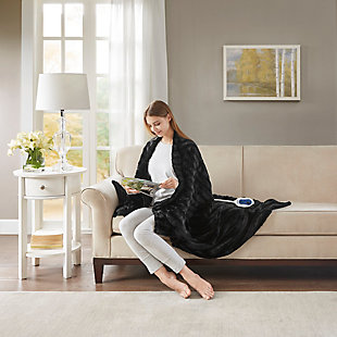 Our heated throw utilizes state of the art Secure Comfort heated technology that adjusts the temperature of your throw based on overall temperature, spot temperatures and the ambient temperature of your room, ensuring a consistent flow of warmth. This unique technology also emits virtually no electromagnetic field emissions, so you can snuggle up with confidence. This throw is oversized, nearly a foot larger in the length and width compared to standard heated throws. The ultra soft faux fur creates a cozy, comfortable throw. Featuring 3 heat settings, this throw is machine washable for easy care.Imported | Virtually no electromagnetic field emissions | Oversized 50"x70" | 3 heat settings | 100% polyester | Ultra soft faux fur | Machine wash | Includes manufacturer’s 5-year warranty