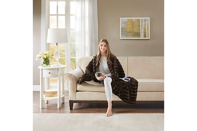 Our heated throw utilizes state of the art Secure Comfort heated technology that adjusts the temperature of your throw based on overall temperature, spot temperatures and the ambient temperature of your room, ensuring a consistent flow of warmth. This unique technology also emits virtually no electromagnetic field emissions, so you can snuggle up with confidence. This throw is oversized, nearly a foot larger in the length and width compared to standard heated throws. The ultra soft faux fur creates a cozy, comfortable throw. Featuring 3 heat settings, this throw is machine washable for easy care.Includes manufacturer’s 5-year warranty.Imported | Virtually no electromagnetic field emissions | Oversized 50"x70" | 3 heat settings | 100% polyester | Ultra soft faux fur | Machine wash | Includes manufacturer’s 5-year warranty