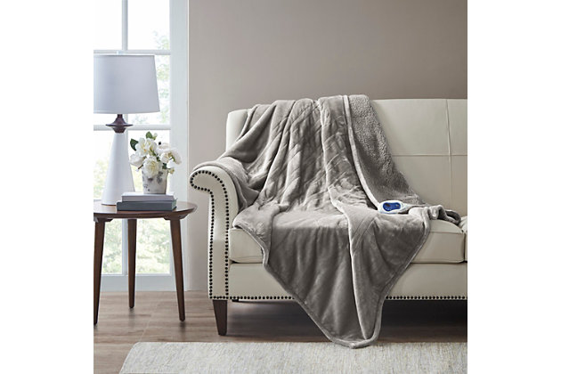 Immerse yourself in comfort in the BeautyRest Heated Microlight reverse to Berber Throw. This heated throw utilizes state of the art Secure Comfort technology that adjusts the temperature of your blanket based on overall temperature, spot temperatures and the ambient temperature of your room, ensuring a consistent flow of warmth. This unique technology also emits virtually no electromagnetic field emissions, so you can snuggle up with confidence. This throw is oversized, nearly a foot larger in the length and width compared to standard heated throws. The ultra soft microlight plush fabric combines with billowy berber in this cozy, comfortable throw. Features 3 heat settings and 2 hour auto shut off. This throw is machine washable for easy care. Includes manufacturer’s 5-year warranty.Imported | Heated | Emits virtually no electromagnetic field emissions | Oversized 60x70" | 3 heat settings | Ultra soft plush | Cozy berber reverse | Machine washable | Includes manufacturer’s 5-year warranty