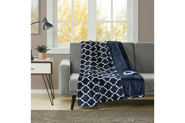 Our heated throw utilizes state of the art Secure Comfort heated technology that adjusts the temperature of your throw based on overall temperature, spot temperatures and the ambient temperature of your room, ensuring a consistent flow of warmth. This unique technology also emits virtually no EMF emissions, so you can snuggle up with confidence. This throw is oversized, nearly a foot larger in the length and width compared to standard heated throws. The ultra soft microlight plush fabric creates a cozy, comfortable throw.It features 3 heat settings and 2 hour auto shut off. This throw is machine washable for easy care.Includes manufacturer’s 5-year warranty.Imported | Heated | Emits virtually no electromagnetic field emissions | Oversized | 3 heat settings | Ultra soft plush | Soft flexible wires | 2 hour auto shut off | Twin and full size have 1 controller, queen and king have 2 controllers | Machine washable | Includes manufacturer’s 5-year warranty