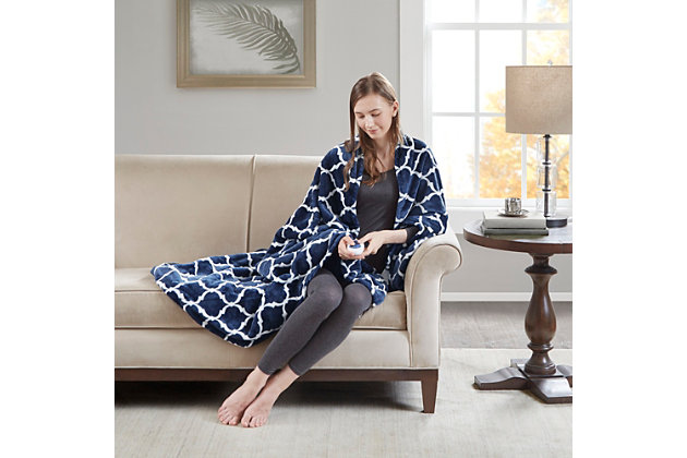 Our heated throw utilizes state of the art Secure Comfort heated technology that adjusts the temperature of your throw based on overall temperature, spot temperatures and the ambient temperature of your room, ensuring a consistent flow of warmth. This unique technology also emits virtually no EMF emissions, so you can snuggle up with confidence. This throw is oversized, nearly a foot larger in the length and width compared to standard heated throws. The ultra soft microlight plush fabric creates a cozy, comfortable throw.It features 3 heat settings and 2 hour auto shut off. This throw is machine washable for easy care.Includes manufacturer’s 5-year warranty.Imported | Heated | Emits virtually no electromagnetic field emissions | Oversized | 3 heat settings | Ultra soft plush | Soft flexible wires | 2 hour auto shut off | Twin and full size have 1 controller, queen and king have 2 controllers | Machine washable | Includes manufacturer’s 5-year warranty
