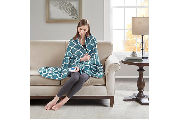 Our heated throw utilizes state of the art Secure Comfort heated technology that adjusts the temperature of your throw based on overall temperature, spot temperatures and the ambient temperature of your room, ensuring a consistent flow of warmth. This unique technology also emits virtually no electromagnetic field emissions, so you can snuggle up with confidence. This throw is oversized, nearly a foot larger in the length and width compared to standard heated throws. The ultra soft microlight plush fabric creates a cozy, comfortable throw.It features 3 heat settings and 2 hour auto shut off. This throw is machine washable for easy care.Includes manufacturer’s 5-year warranty.Imported | Virtually no electro magnetic field emissions | 3 heat settings | 2 hour auto shut off | Oversized | Machine washable | Ogee pattern | Includes manufacturer’s 5-year warranty.