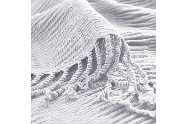 This soft acrylic throw features all over ruching for added texture and dimension. It's accented with a 2 inch fringe.Imported | Ruched design | 2" fringe | Machine washable