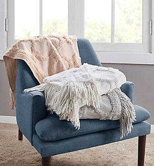 Add a cozy farmhouse touch to your home with the Madison Park Brianne Cotton Tufted Throw. This grey cotton throw flaunts a tufted geometric pattern with a 4-inch fringe on each end that adds texture and dimension, for a charming country allure. The 100% cotton fabric creates a lightweight and natural feel, making this cottage throw perfect for all seasons. Machine washable for easy care, this cotton tufted throw is great as a layering piece across your bed or can be hung like a tapestry for a chic accent on your wall.Imported | 100% cotton tufted throw | 4" fringe | Natural cotton feel | Machine washable