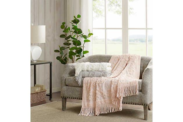 The Madison Park Chloe Cotton Tufted Throw provides a luxurious addition to your home decor. This ivory throw flaunts an elegant tufted chenille design with a 4-inch fringe on each end, for a beautiful bohemian look. The ultra-soft 100% cotton construction creates a light natural feel that’s perfect for all seasons. Machine washable, this cotton tufted throw is great for layering across your bed or for simply bundling up in to stay warm and cozy.Imported | 100% cotton tufted chenille throw | 4" fringe | Ultra soft | Machine washable