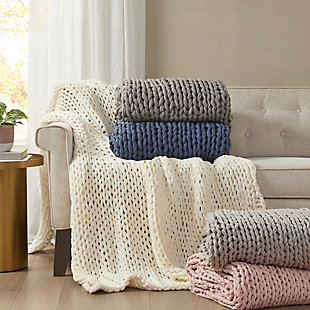 Get warm and cozy with the Madison Park Chunky Double Knit Handmade Throw. This handmade blush chunky cable knit throw is double-knitted for durability and an incredible soft-hand feel. The hand-knit throw has a lovely ribbon tied around it, making it a thoughtful gift. Soft and cozy, this handmade knit throw is perfect to snuggle up in and offers a shabby chic addition to your home. Spot clean or hand wash only.Imported | Comfy hand knit throw 50x60" | Double knitted for duarbility | Soft hand feel | Giftable - ribbon tied for easy gifting | Spot clean or hand wash
