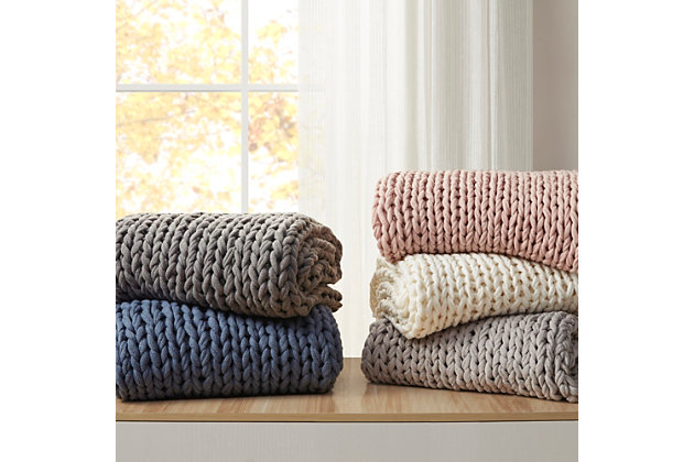 Get warm and cozy with the Madison Park Chunky Double Knit Handmade Throw. This handmade blush chunky cable knit throw is double-knitted for durability and an incredible soft-hand feel. The hand-knit throw has a lovely ribbon tied around it, making it a thoughtful gift. Soft and cozy, this handmade knit throw is perfect to snuggle up in and offers a shabby chic addition to your home. Spot clean or hand wash only.Imported | Comfy hand knit throw 50x60" | Double knitted for duarbility | Soft hand feel | Giftable - ribbon tied for easy gifting | Spot clean or hand wash