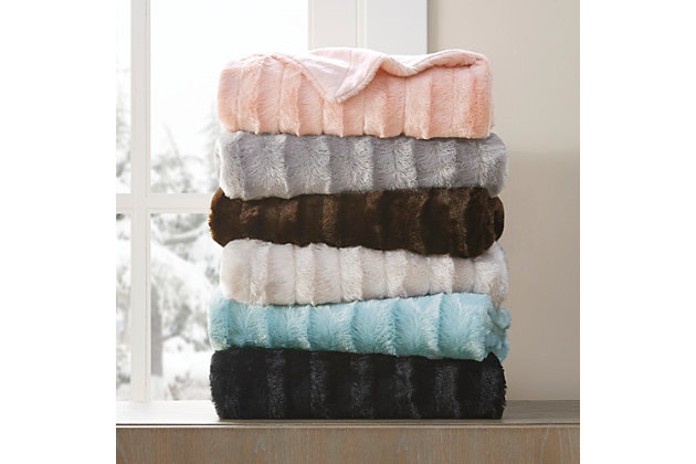 Bundle up in the lush comfort of the Madison Park Duke Long Fur Throw. This ultra-soft plush throw provides exceptional warmth and comfort, while a micro fur reverse adds extra softness to the design. Layer the throw blanket on your bed to keep yourself warm on cold nights or lay it across your sofa for a decorative piece. Made from 300gsm polyester brushed long fur, this throw is machine washable for easy care.Imported | Ultra soft plush | 50"x60" | Machine wash