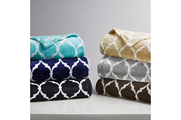This Madison Park super soft microlight oversized plush throw features a modern ogee print that adds style and flair to any room. MicroLight is the next generation in plush throws. Our unique knitting technology allows us to craft an irresistibly soft, ultra lofty throw that is light enough to be used during even the warmest summer months and is perfect as a layering piece during the coldest of winters. It's machine washable for easy care.Imported | Oversized | Machine washable | Soft plush fabric | Ogee print