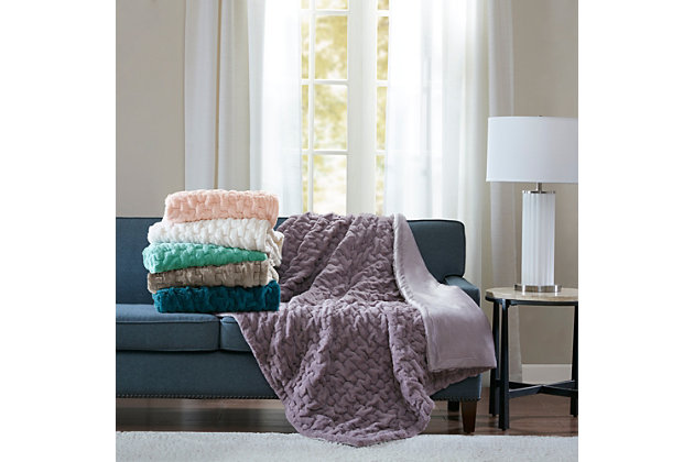 Add a modern and sophisticated throw to any space with the Madison Park Ruched Fur throw. The throw features an ultra soft long fur that will keep you warm and cozy.Imported | Ruched pattern | Ultra soft long fur | 50"x60" | Machine wash