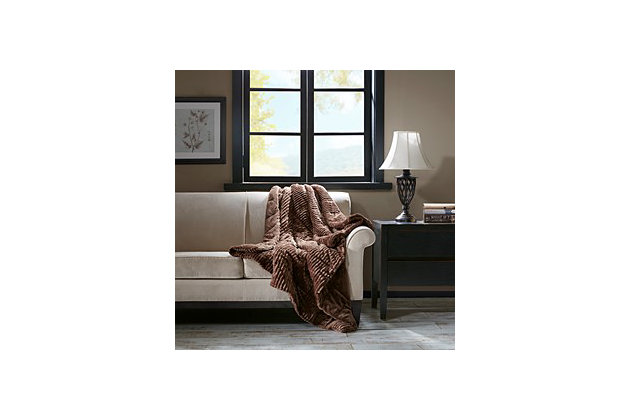 This super cozy throw will keep you warm all winter. Made from an ultra soft plush and reversing to a thick berber this throw is lofty and can be used as an additional layer for added warmth.Imported | Ultra soft plush | Corduroy pattern | Oversized 60x70" | Machine washable | 100% polyester | End to end box quilting