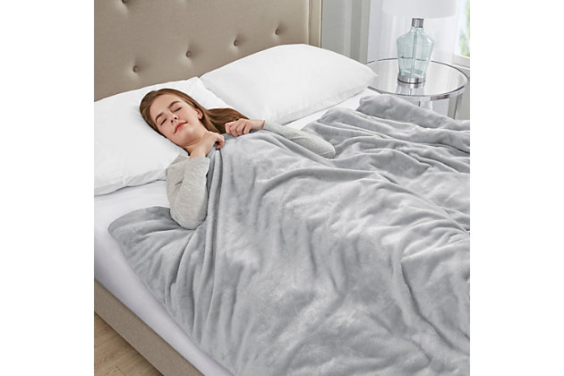 The Sleep Philosophy plush weighted blanket is a safe and effective remedy for anyone looking for a better night’s sleep or just to feel a little more relaxed after a stressful day at the office. The 60”x70” blanket distributes pressure all over your body, touching pressure points that can help reduce stress and anxiety. At the same time it creates a feeling of being held or hugged to make you feel secure and relaxed. The weighted insert is box-sewn to prevent the poly and glass bead filling from shifting during use. There are 10 ties inside the plush cover to secure the insert in place. Using a weighted blanket can help relax user's mind and in turn promote a deep and restful sleep throughout the night. This blanket can be used in many different ways by covering your whole body for sleep or simply wrap it around your shoulders or lay it across your lap or legs. Choose a blanket that’s around 10% of your body weight, available in 12 or 18 pound size. The plush cover with a zipper closure is removable for easy machine washing.Imported | Provides all over body comforting pressure, making you feel secure and relaxed | Weighted blanket designed for adults or minimum body weight of 120 lbs or more | Poly fill and glass beads fillig weight to promote a deep and restful sleep throughout the night | Removable plush cover zipper closure is machine washable for easy care | 10 inside ties efficiently stay put the weighted insert | Available in 12 lb and 18 lb weights