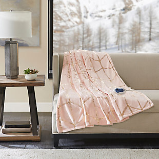 True North by Sleep Philosophy offers incredible comfort and style with the Raina Heated Metallic Print Throw. A gold metallic geometric design is beautifully printed on an ultra-soft plush blush base fabric. Emitting virtually no electromagnetic field emissions, this throw features three heat settings and a 2-hour shut-off timer to provide the perfect amount of warmth and comfort. Bundle up in comfort and add a casual touch with a glamorous flair to your home with this heated metallic print throw. Includes manufacturer’s 5-year warranty.Imported | Virtually no electromagnetic field emissions | 3 heat settings | 2 hour auto shut off | Ultra soft plush | 5 year warranty | Machine wash | Includes manufacturer’s 5-year warranty
