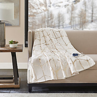 True North by Sleep Philosophy offers incredible comfort and style with the Raina Heated Metallic Print Throw. A gold metallic geometric design is beautifully printed on an ultra-soft plush ivory base fabric. Emitting virtually no electromagnetic field emissions, this throw features three heat settings and a 2-hour shut-off timer to provide the perfect amount of warmth and comfort. Bundle up in comfort and add a casual touch with a glamorous flair to your home with this heated metallic print throw. Includes manufacturer’s 5-year warranty.Imported | Virtually no electromagnetic field emissions | 3 heat settings | 2 hour auto shut off | Ultra soft plush | 5 year warranty | Machine wash | Includes manufacturer’s 5-year warranty