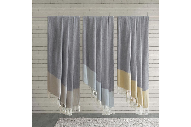 Accented with a fun fringe, this classic color block throw is super soft and cozy.Imported | Color block | 50x60" | 100% acrylic | Machine washable | 4" fringe