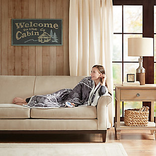 The Woolrich heated throw utilizes state of the art Secure Comfort heated technology that adjusts the temperature of your throw based on overall temperature, spot temperatures and the ambient temperature of your room, ensuring a consistent flow of warmth. This unique technology also emits virtually no electromagnetic field emissions, so you can snuggle up with confidence. This throw is oversized, nearly a foot larger in the length and width compared to standard heated throws. The ultra soft faux mink fabric and the lofty berber reverse creates a cozy, comfortable throw. Features 3 heat settings and 2 hour auto shut off. This throw is machine washable for easy care. Includes manufacturer’s 5-year warranty.Imported | Heated | Emits virtually no electromagnetic field emissions | Oversized 60x70" | 3 heat settings | Ultra soft plush | Cozy berber reverse | Machine washable | Includes manufacturer’s 5-year warranty