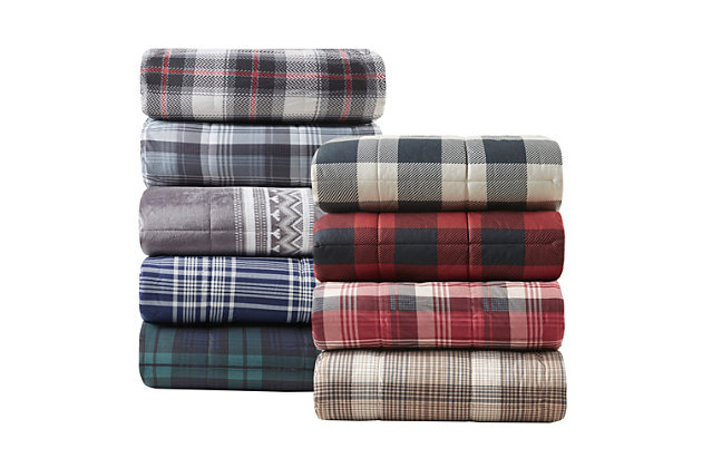 Whether you want to bundle up while reading a book or need a decorative piece for the end of your bed, the Woolrich Tasha Down Alternative Throw is perfect for your home. This throw blanket features a plaid print on ultra-soft cozyspun fabric with a lush berber reverse. The down alternative filling provides extra warmth and softness, while the box-quilting prevents the fill from shifting. Machine washable for easy care, this oversized throw will keep you warm and comfortable through all seasons.Imported | Ultra soft fabric | Cozy berber reverse | Down alternative filling | Oversized 50"x70" | Plaid print | Machine wash