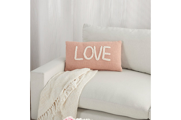 You’ll feel the love when you recline in style with this chic throw pillow from mina victory home accents. It’s handmade with a softly tufted word graphic on a textured cotton cover, and filled to perfect plumpness. This playful pillow, crafted in blush pink with white embellishment, includes a zipper closure with soft polyfill insert.Handcrafted from 100% cotton | Soft polyfill | Softly tufted lettering | Zipper closure | Spot clean | Imported