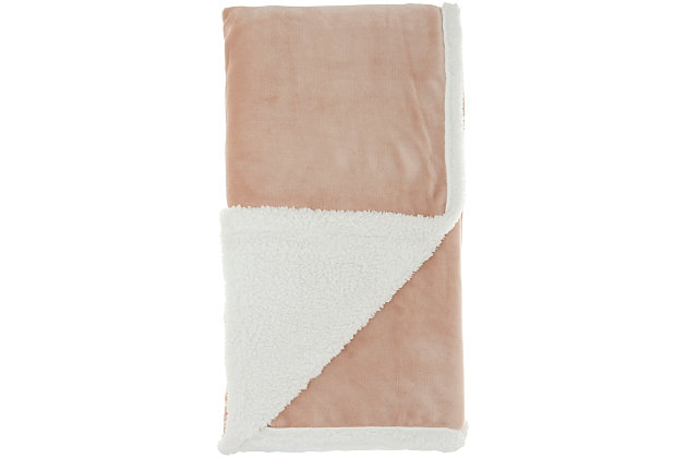 Stay warm and toasty with this fluffy sherpa fleece throw blanket from mina victory home accents. Handmade in a soft blush pink tone, it reverses to a velvet back for two looks in one. Drape over the corner of your living room couch or at the foot of your bed for an extra-inviting look. This throw is large enough to use as a blanket and stylish enough to use as an accent piece.Handcrafted from 100% polyester | Sherpa fleece | Reverses to poly velvet | Imported