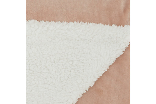 Stay warm and toasty with this fluffy sherpa fleece throw blanket from mina victory home accents. Handmade in a soft blush pink tone, it reverses to a velvet back for two looks in one. Drape over the corner of your living room couch or at the foot of your bed for an extra-inviting look. This throw is enough to use as a blanket and stylish enough to use as an accent piece.Handcrafted from 100% polyester | Sherpa fleece | Reverses to poly velvet | Imported