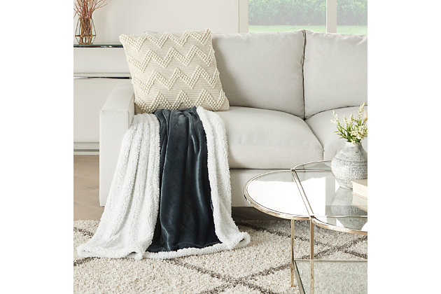Stay warm and toasty with this fluffy sherpa fleece throw blanket from mina victory home accents. Handmade in a charcoal gray tone, it reverses to a velvet back for two looks in one. Drape over the corner of your living room couch or at the foot of your bed for an extra-inviting look. This throw is large enough to use as a blanket and stylish enough to use as an accent piece.Handcrafted from 100% polyester | Sherpa fleece | Reverses to poly velvet | Imported